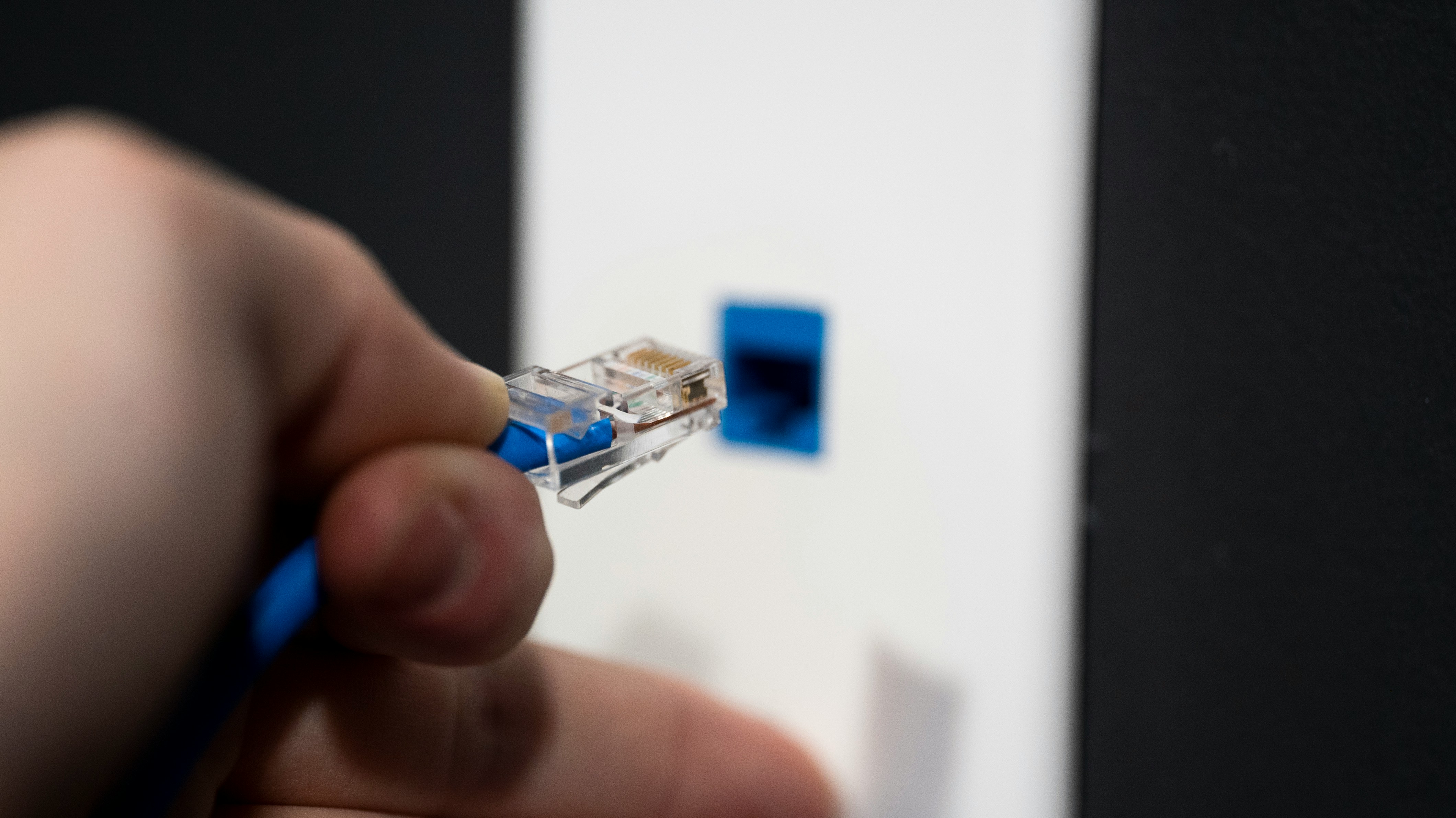 Plugging in an ethernet cable,